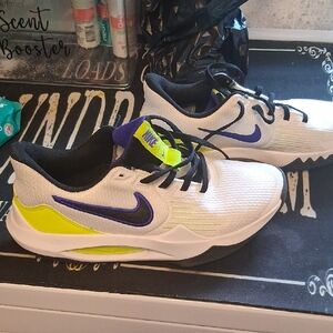 Nike White and Purple Athletic Shoes with Yellow Highlights